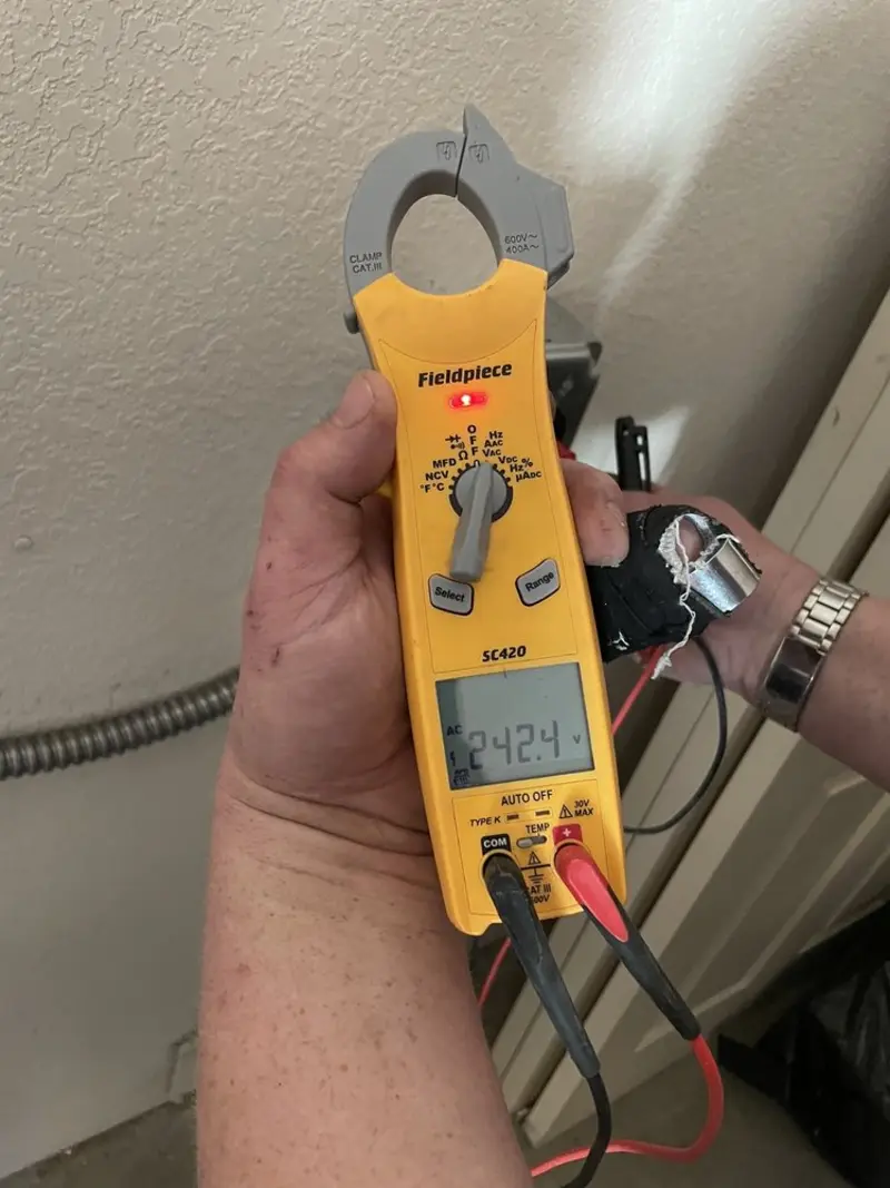 Voltage testing with clamp meter during Electrical Installation Services in Stone Park